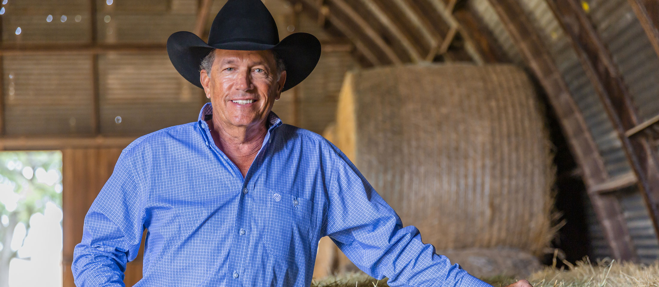 George Strait smiling for the camera.